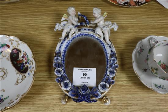 A Dresden floral encrusted cup and saucer, a quantity of Royal Crown Derby teaware and a Sitzendorf wall mirror